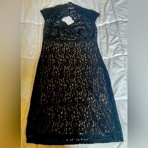 Black lace cocktail dress. Form fitting. Sparkles a touch. Worn once.